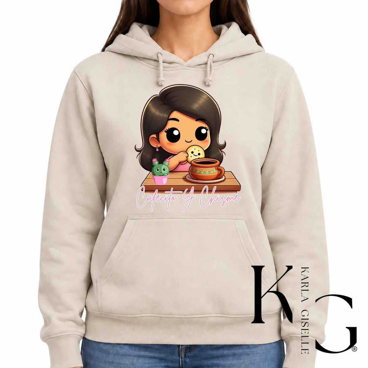 Cafecito y Chisme graphic on a beige hoodie