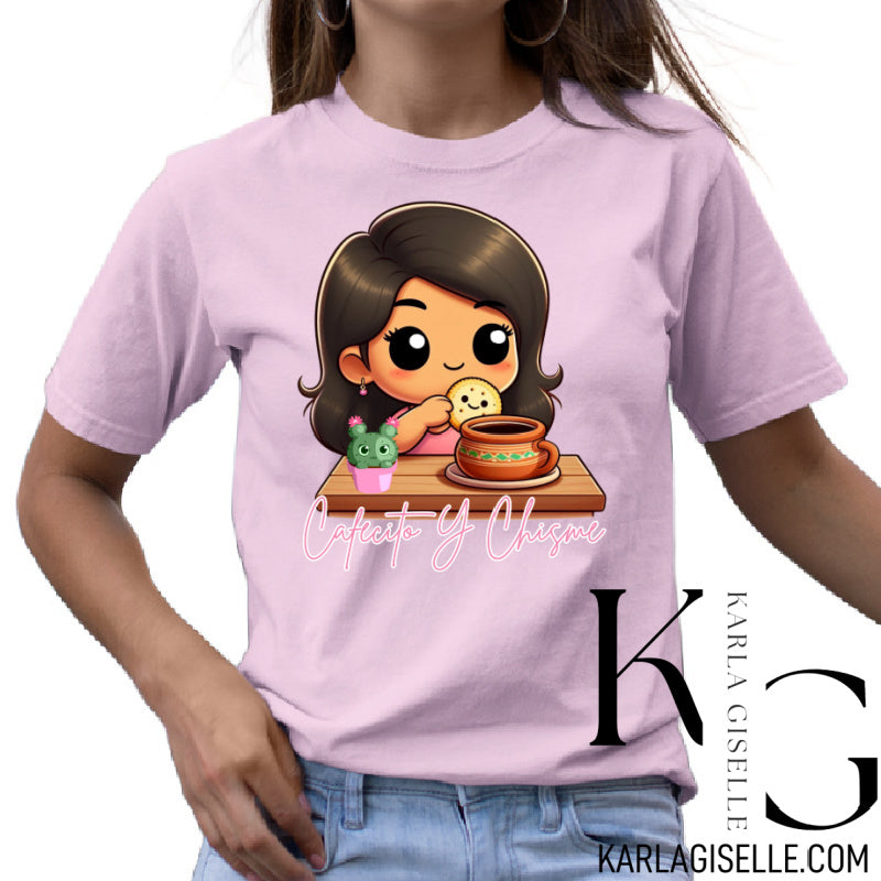 Cafecito y Chisme graphic on a pink T-shirt