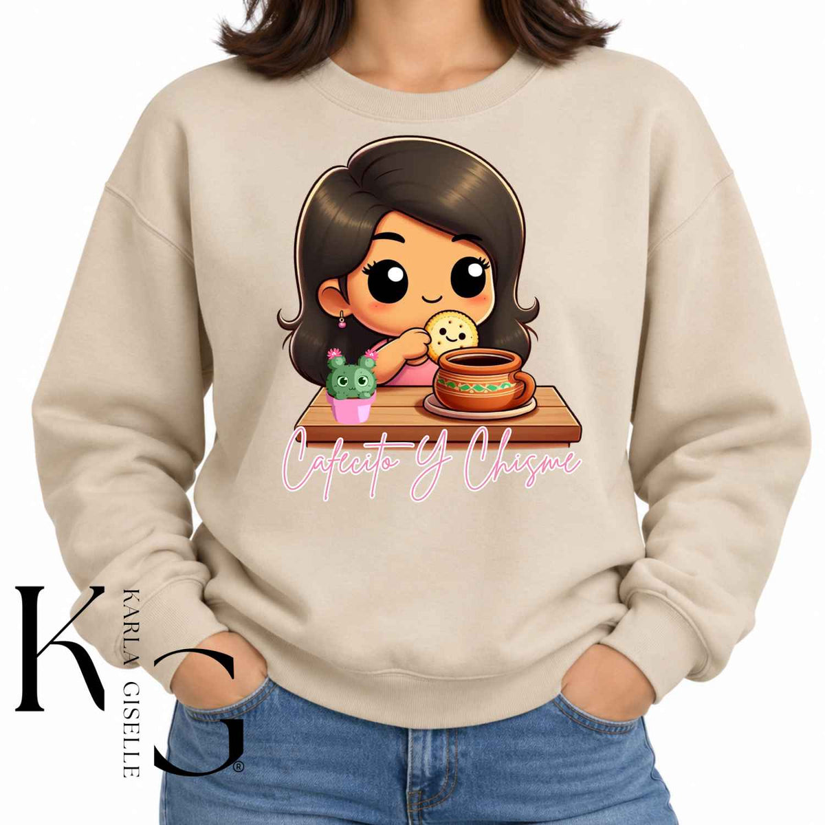 Cafecito y Chisme graphic on a beige crewneck sweatshirt